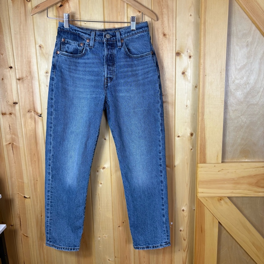 Levi’s 501 button fly jeans size 26 X 26 distressed medium wash denim capsule